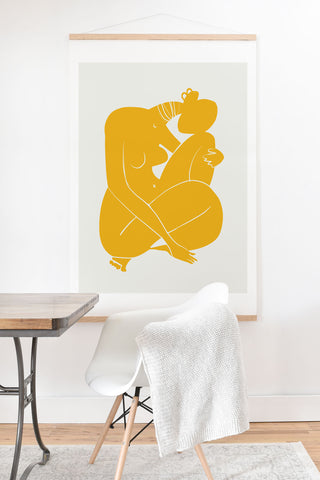 Little Dean Baby hug nude in yellow Art Print And Hanger