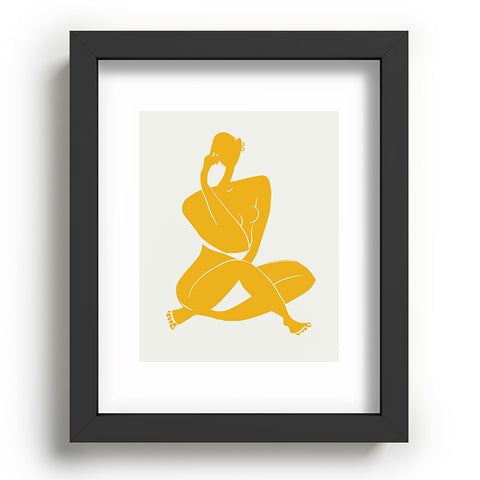Little Dean Nude sitting in yellow Recessed Framing Rectangle