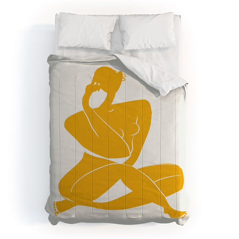 Little Dean Nude sitting in yellow Comforter