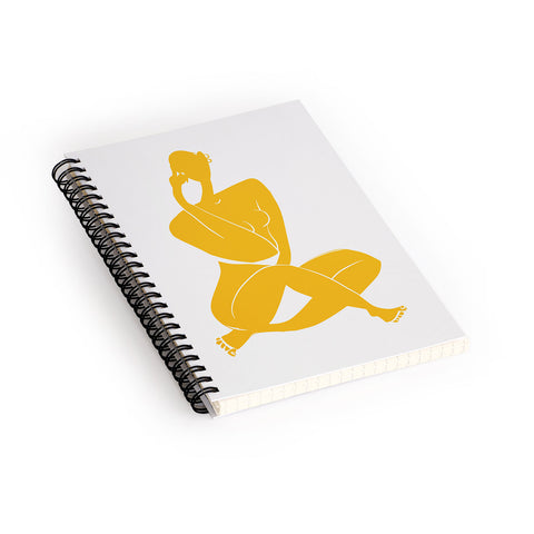 Little Dean Nude sitting in yellow Spiral Notebook