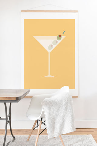 Lyman Creative Co Martini with Olives on Yellow Art Print And Hanger