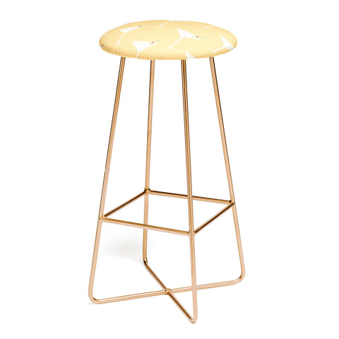 Lyman Creative Co Martini with Olives on Yellow Bar Stool