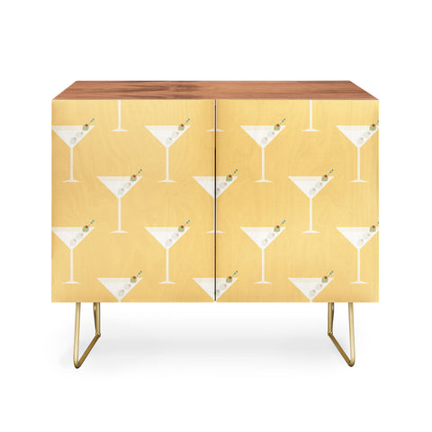 Lyman Creative Co Martini with Olives on Yellow Credenza