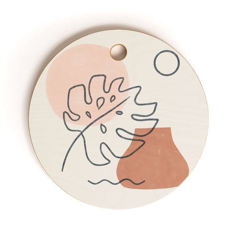 Madeline Kate Martinez a warm feeling Cutting Board Round