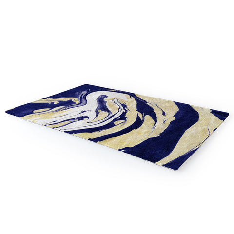 Marta Barragan Camarasa Abstract painting of blue and golden waves Area Rug