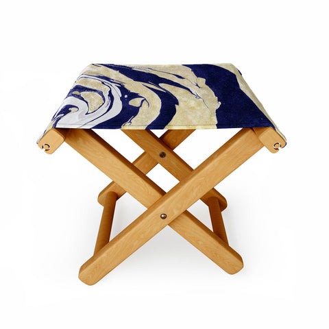 Marta Barragan Camarasa Abstract painting of blue and golden waves Folding Stool