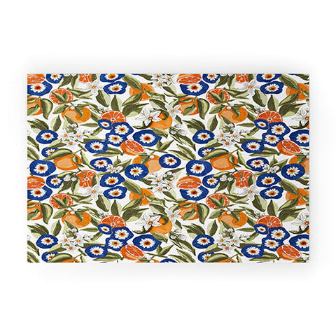 Marta Barragan Camarasa Blue flowers on orange B Welcome Mat