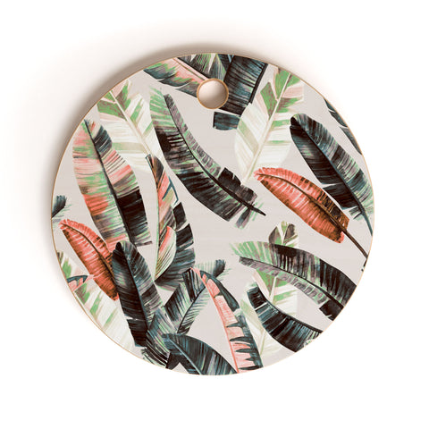 Marta Barragan Camarasa Winter palm trees Cutting Board Round