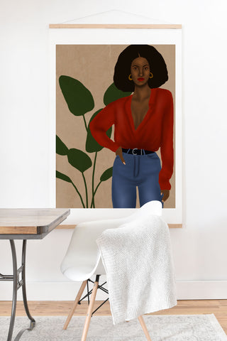nawaalillustrations girl in red Art Print And Hanger