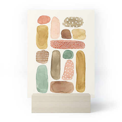 https://www.denydesigns.com/cdn/shop/products/pauline-stanley-watercolor-beach-pebbles-stand-white_large.jpg?v=1633105913