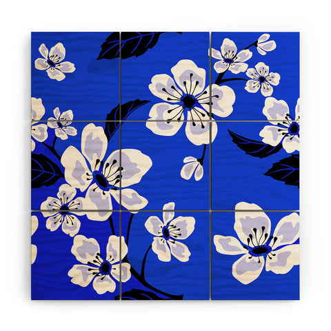 PI Photography and Designs Blue Sakura Flowers Wood Wall Mural