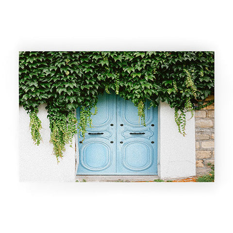 raisazwart The blue door of Montmartre Paris Welcome Mat