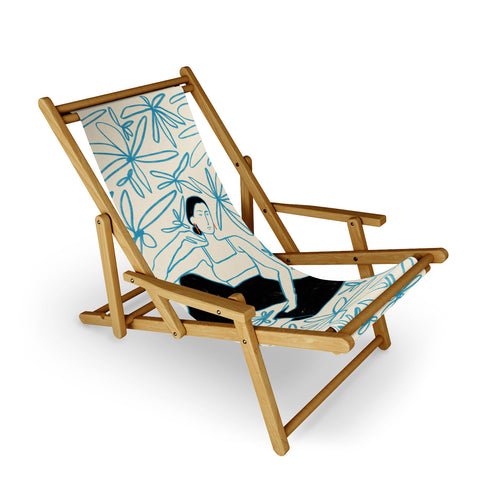 sandrapoliakov WOMAN IN A FIELD OF FLOWERS Sling Chair