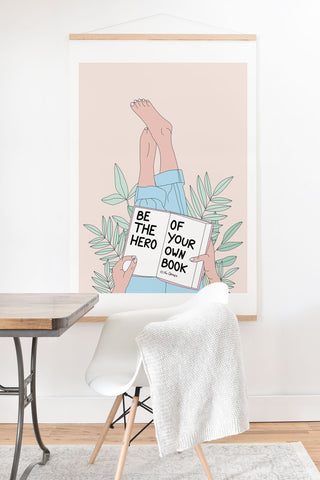 The Optimist Be The Hero Of Your Own Book Art Print And Hanger