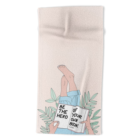 The Optimist Be The Hero Of Your Own Book Beach Towel